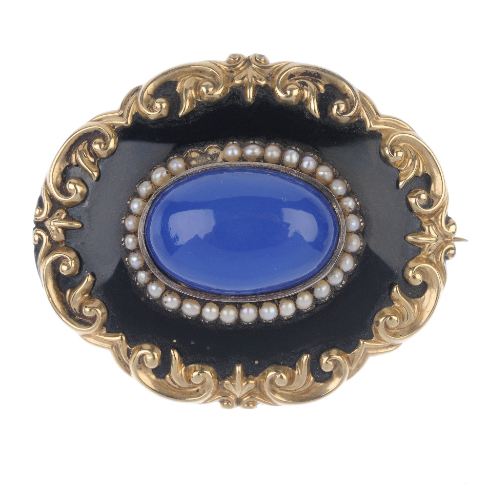 A mid Victorian enamel and gem-set memorial brooch. The replacement oval blue chalcedony cabochon,