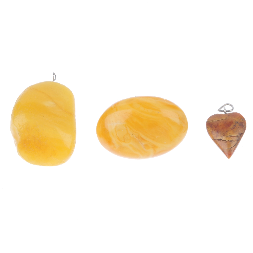 A selection of natural and modified amber jewellery. To include a natural amber brooch of oval