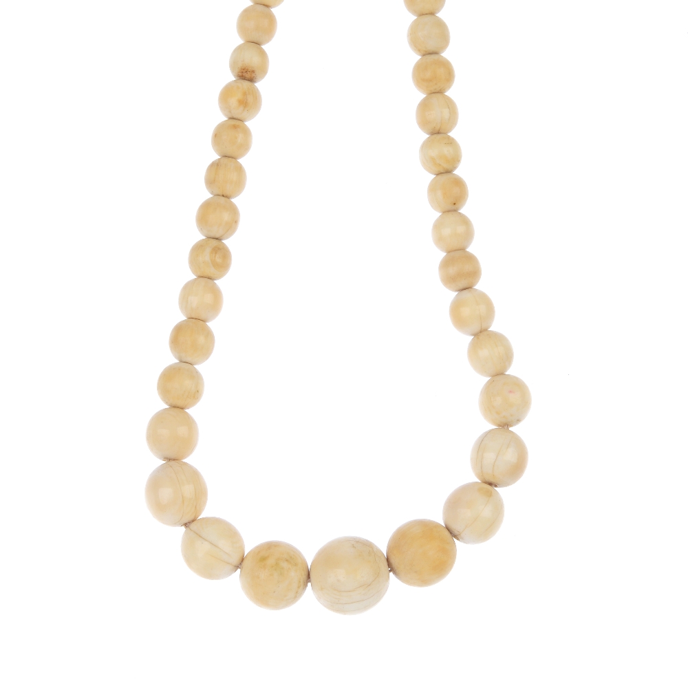 An early 20th century ivory necklace. Comprising 114 graduated ivory beads, to the screw clasp.