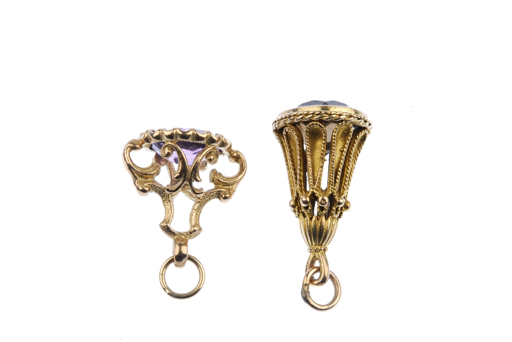 Two 9ct gold gem-set fobs. The first designed as an oval-shape amethyst to the scrolling 9ct gold - Image 2 of 2