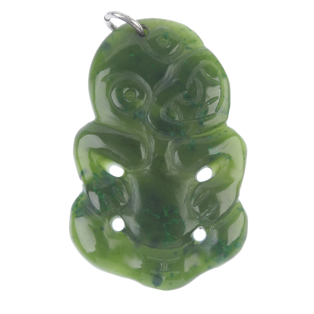 A Maori jade hei-tiki. The Maori jade carved as a typical hei-tiki to the plain surmount loop.