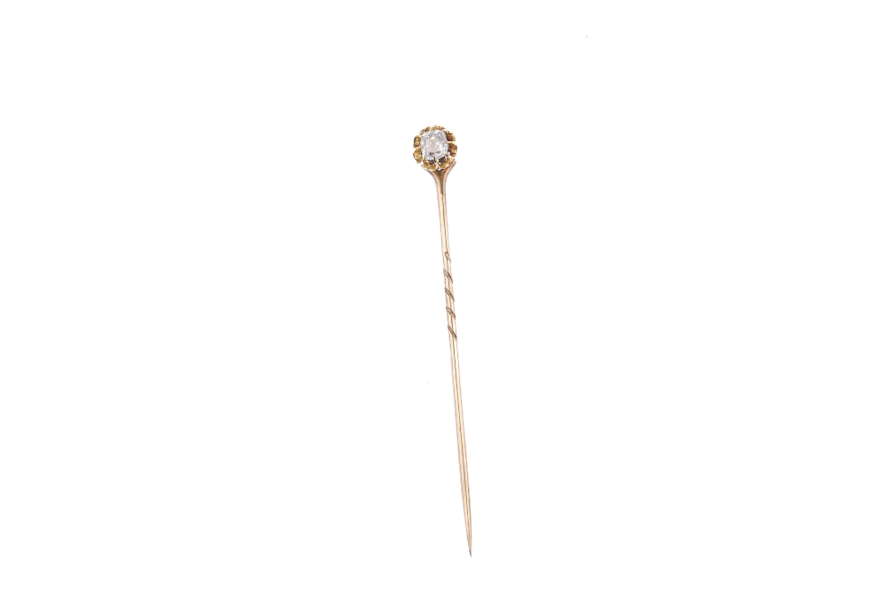 An early 20th century gold diamond stickpin. The old-cut diamond, within an elongated claw - Image 2 of 2