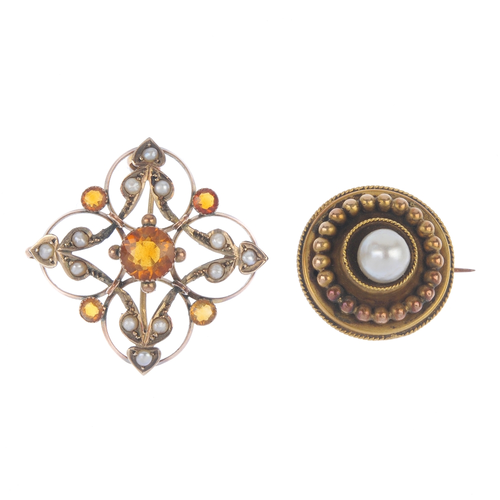 Two early 20th century gold brooches. The first of open circular and scroll shapes, to the central