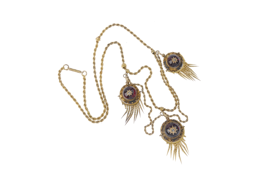 A mid 19th century gold garnet and diamond necklace. Comprising three circular-shape foil-back - Image 2 of 2