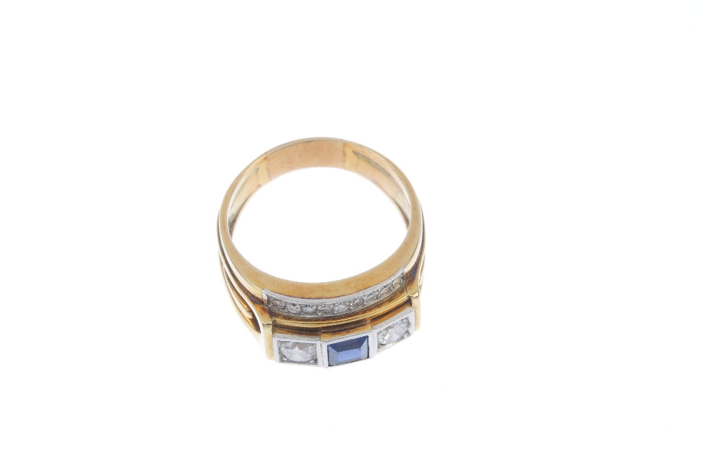 A sapphire and diamond dress ring. The square-shape sapphire, with brilliant-cut diamond sides, to - Image 2 of 4