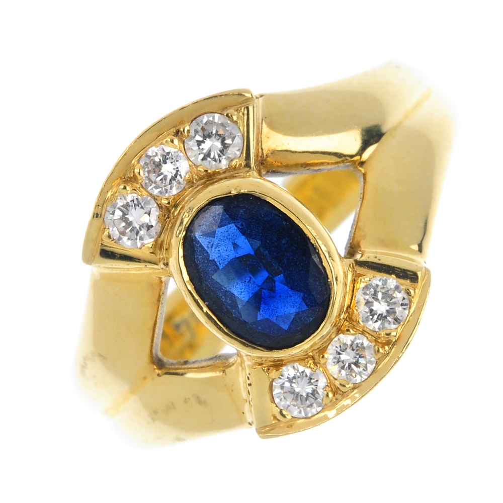 A sapphire and diamond dress ring. The oval-shape sapphire collet, to the brilliant-cut diamond