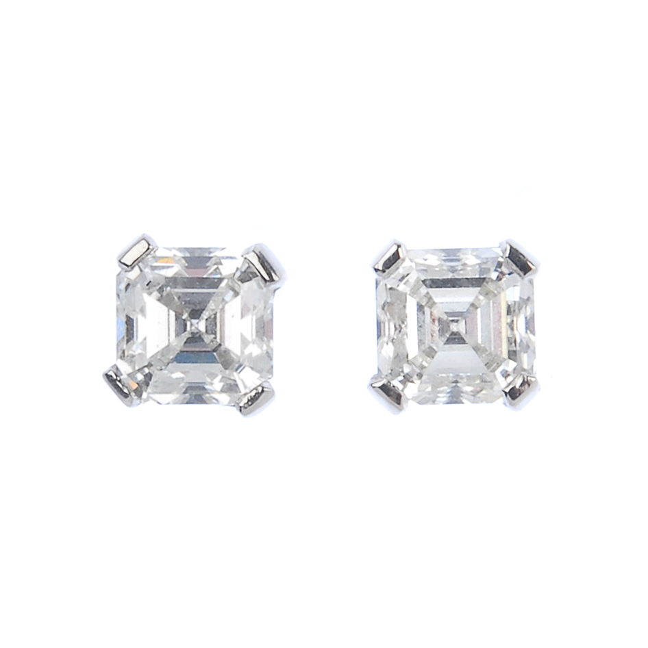 A pair of platinum square-shape diamond ear studs. Accompanied by mini report number 20025968,