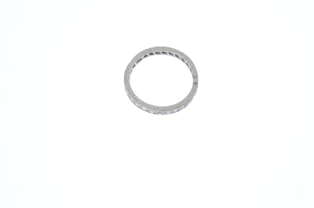 A mid 20th century platinum diamond full-circle eternity ring. The circular-cut diamond line, to the - Image 2 of 3