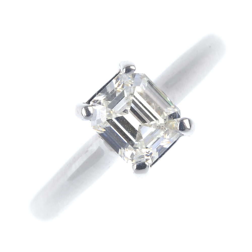 An 18ct gold diamond single-stone ring. The rectangular-shape diamond, to the plain band.