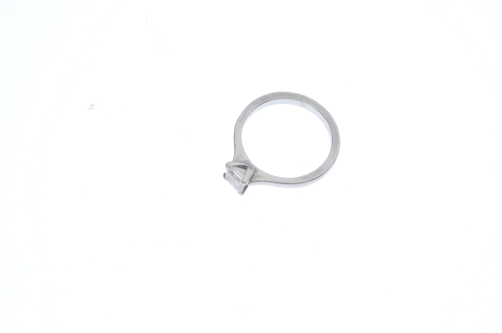 A platinum diamond single-stone ring. The square-shape diamond, weighing 0.55ct, to the tapered - Image 2 of 5