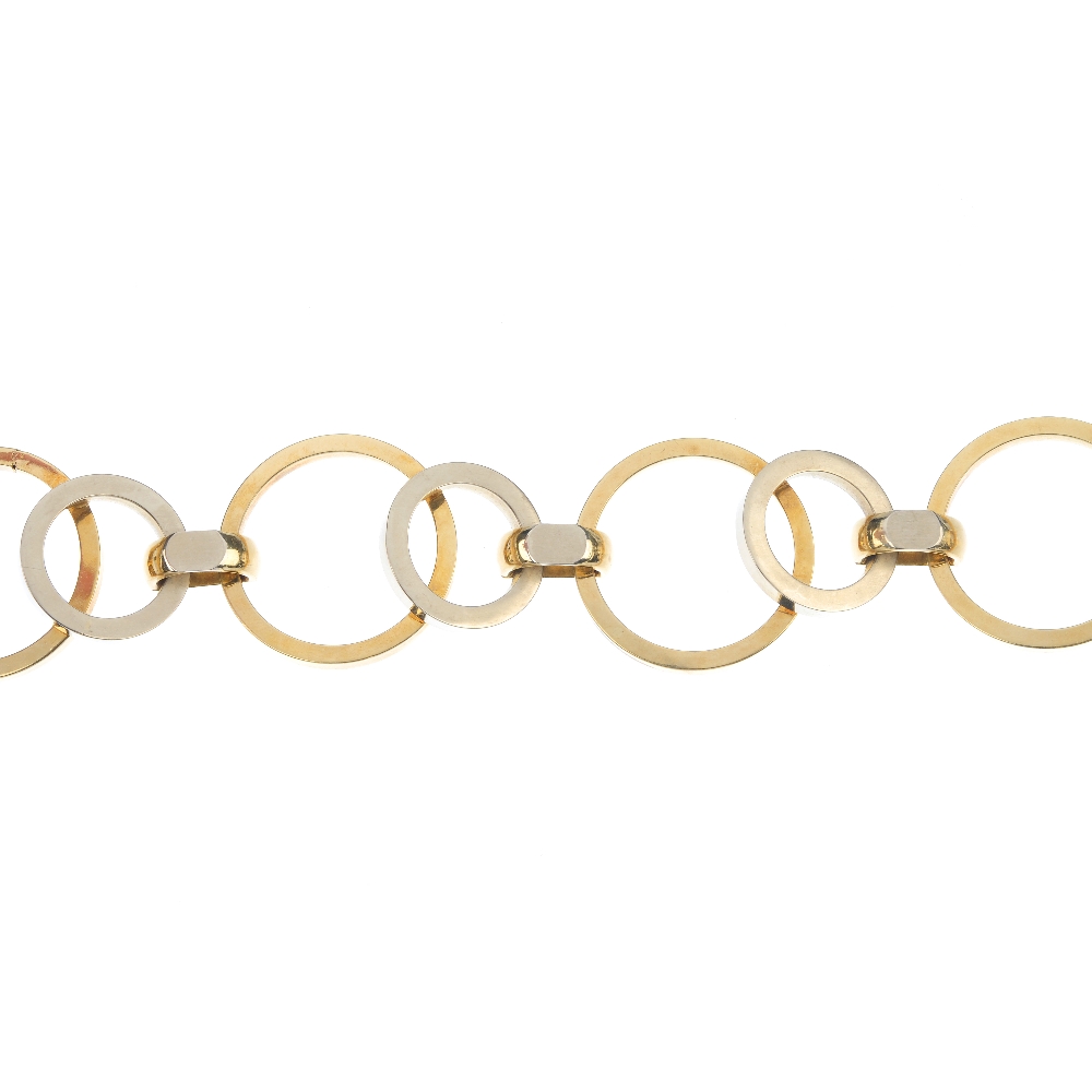 A bi-colour bracelet. Designed as a series of vari-shape circular-shape links, to the concealed
