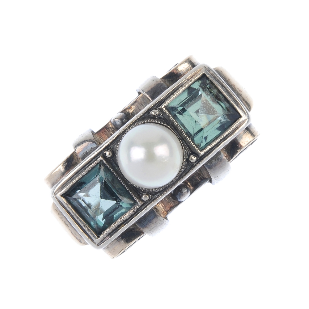 A mid 20th century cultured pearl and synthetic spinel three-stone ring. The cultured pearl, to