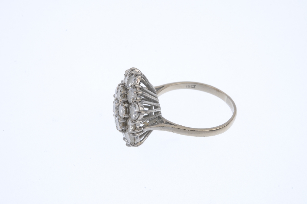 A diamond cluster ring. The brilliant-cut diamond, within a similarly-cut diamond double surround, - Image 3 of 4