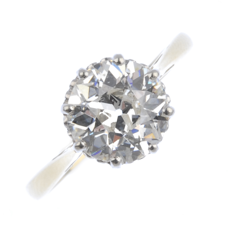 An 18ct gold diamond single-stone ring. The old-cut diamond, to the plain band. Estimated diamond