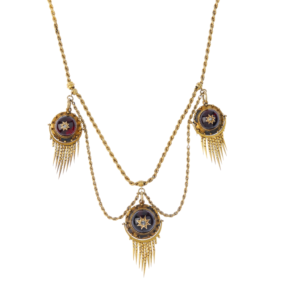 A mid 19th century gold garnet and diamond necklace. Comprising three circular-shape foil-back