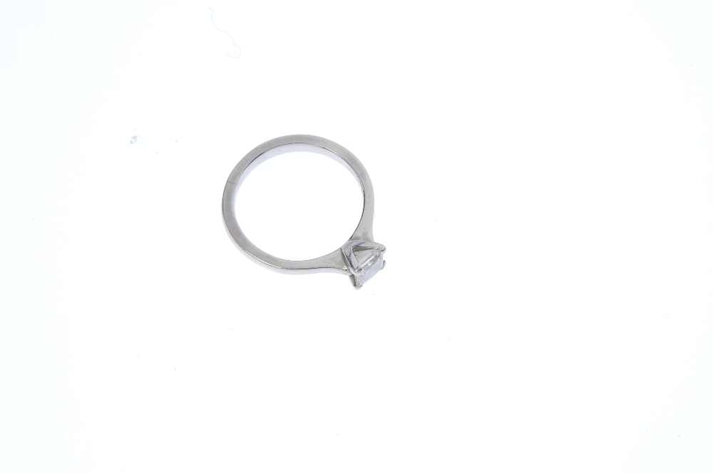 A platinum diamond single-stone ring. The square-shape diamond, weighing 0.55ct, to the tapered - Image 3 of 5