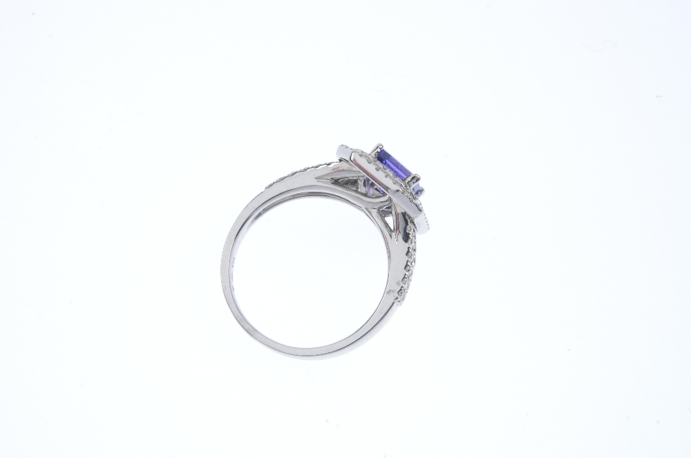 An 18ct gold tanzanite and diamond cluster ring. The square-shape tanzanite, within a brilliant- - Image 4 of 4