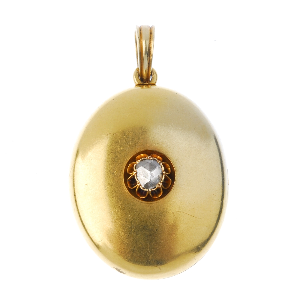 A late 19th century 18ct gold diamond locket. The front set with a rose-cut diamond, to the plain