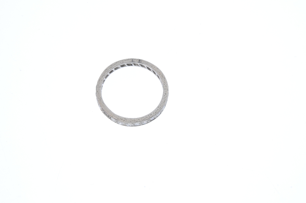A mid 20th century platinum diamond full-circle eternity ring. The circular-cut diamond line, to the - Image 3 of 3