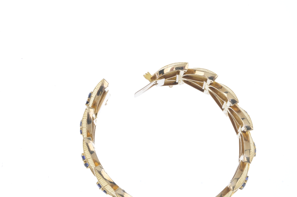 A 1960s 9ct gold sapphire bracelet. Designed as a series of textured twin leaf links, with - Image 3 of 4