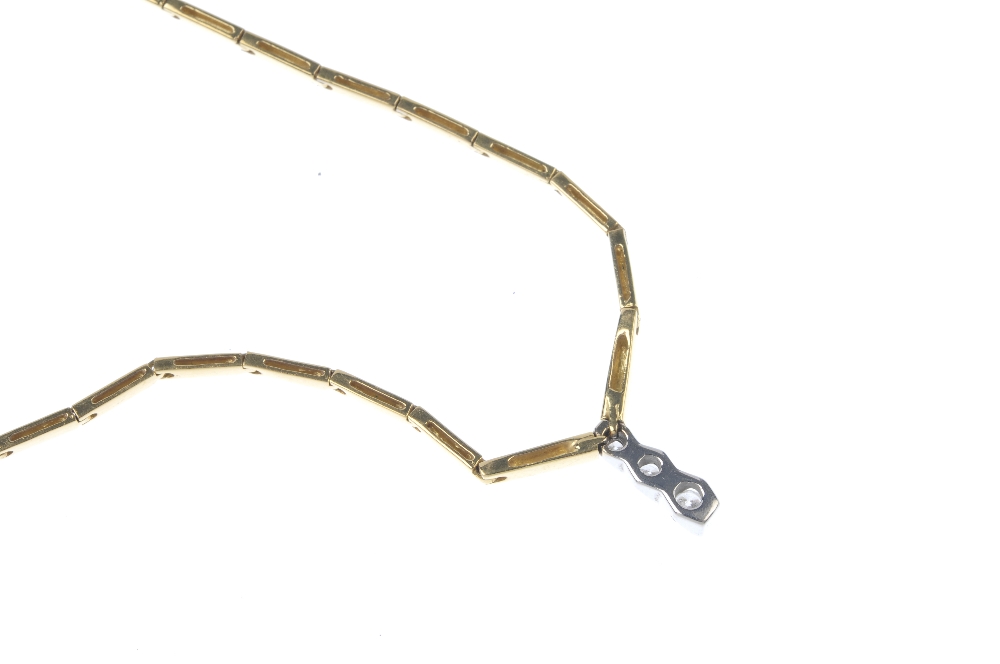 An 18ct gold diamond necklace. The graduated brilliant-cut diamond line, with bar spacers, suspended - Image 2 of 3