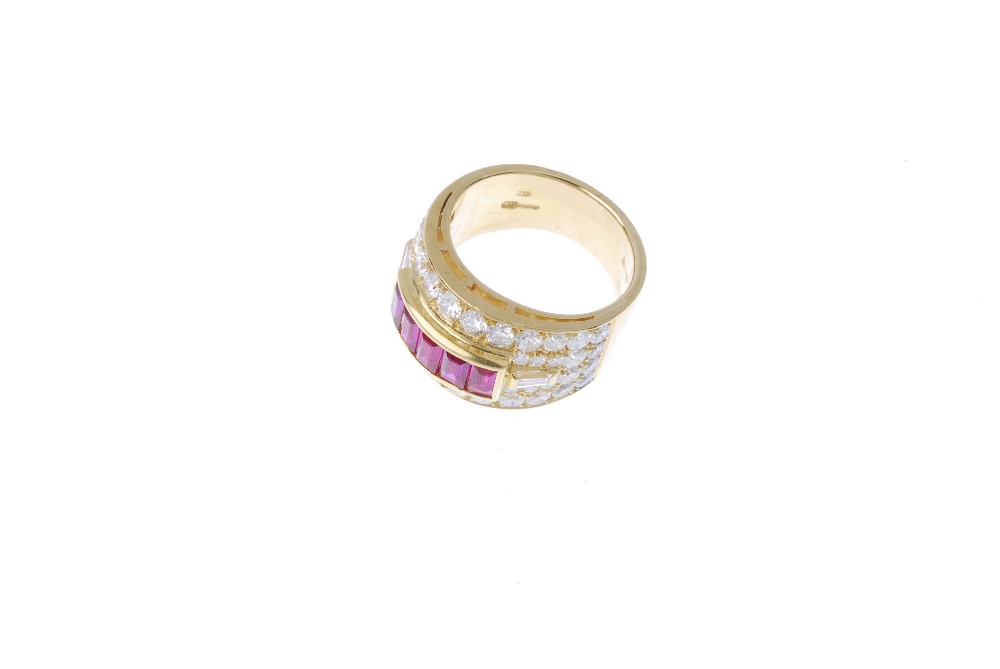 An 18ct gold ruby and diamond dress ring. The rectangular-shape ruby line, within a brilliant-cut - Image 2 of 4