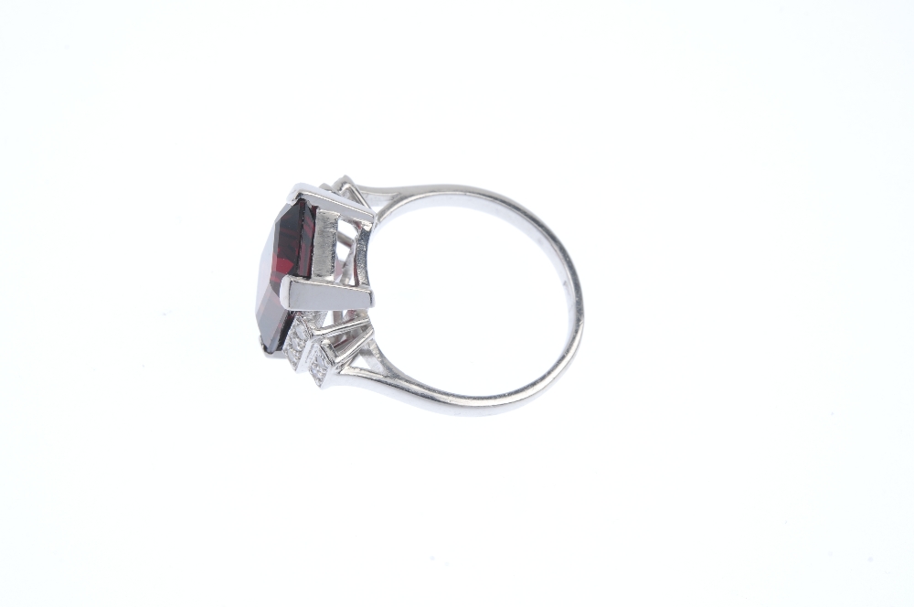 A garnet and diamond dress ring. The rectangular-shape garnet, to the single-cut diamond tiered - Image 3 of 4