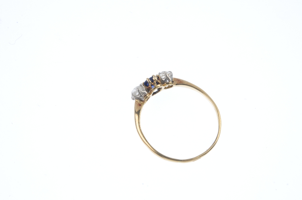 A sapphire and diamond three-stone ring. The oval-shape sapphire, with old-cut diamond sides, to the - Image 4 of 4