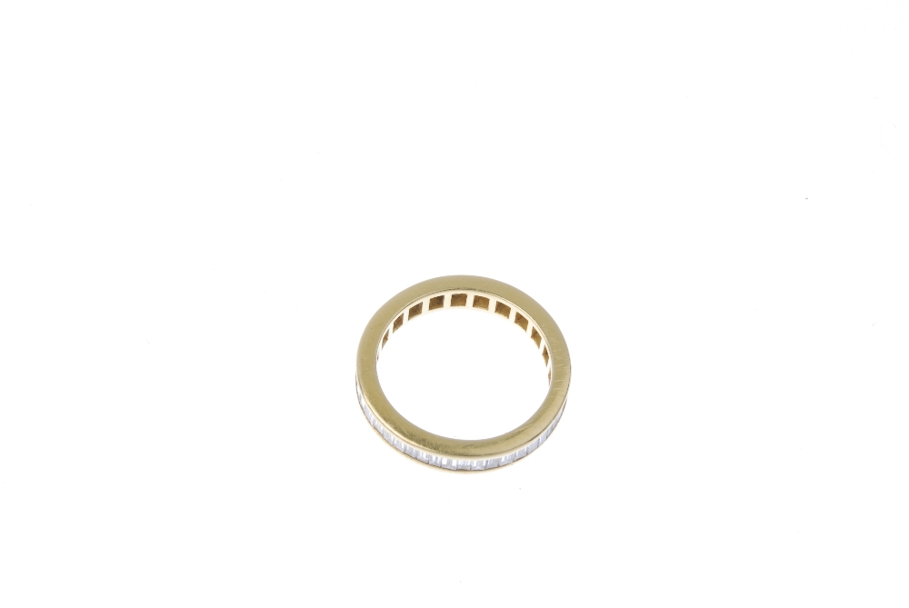 An 18ct gold diamond full-circle eternity ring. The rectangular-shape diamonds, within a chanel- - Image 2 of 3