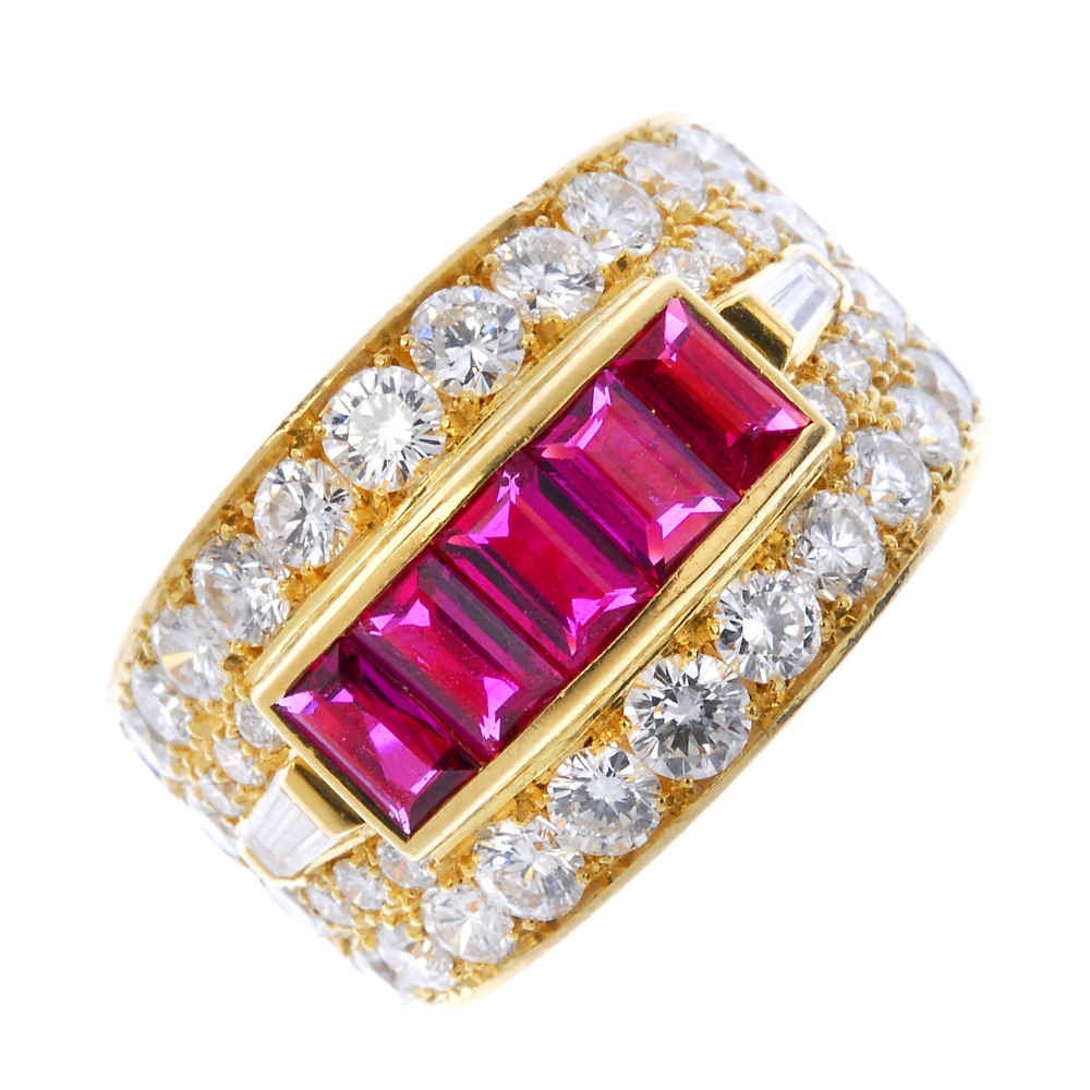 An 18ct gold ruby and diamond dress ring. The rectangular-shape ruby line, within a brilliant-cut