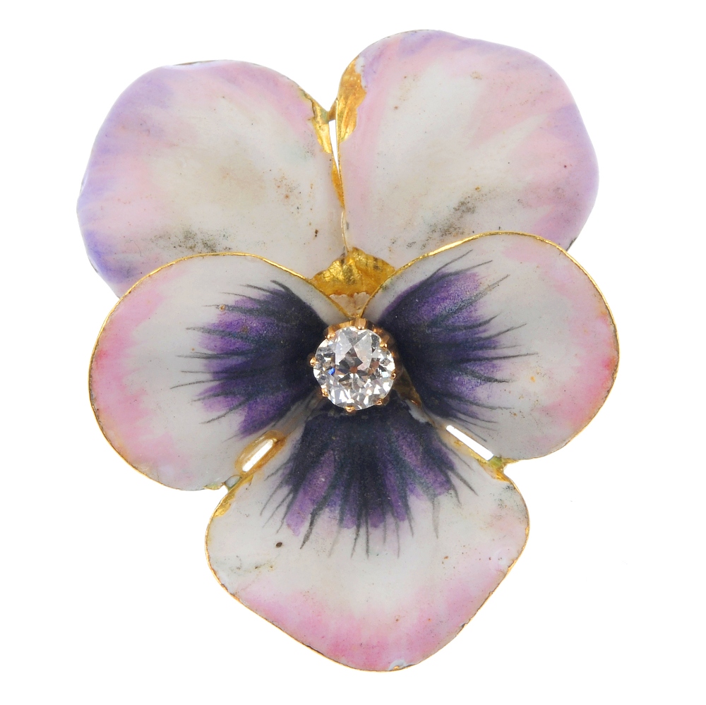 An early 20th century 18ct gold diamond and enamel viola brooch. The old-cut diamond, within a