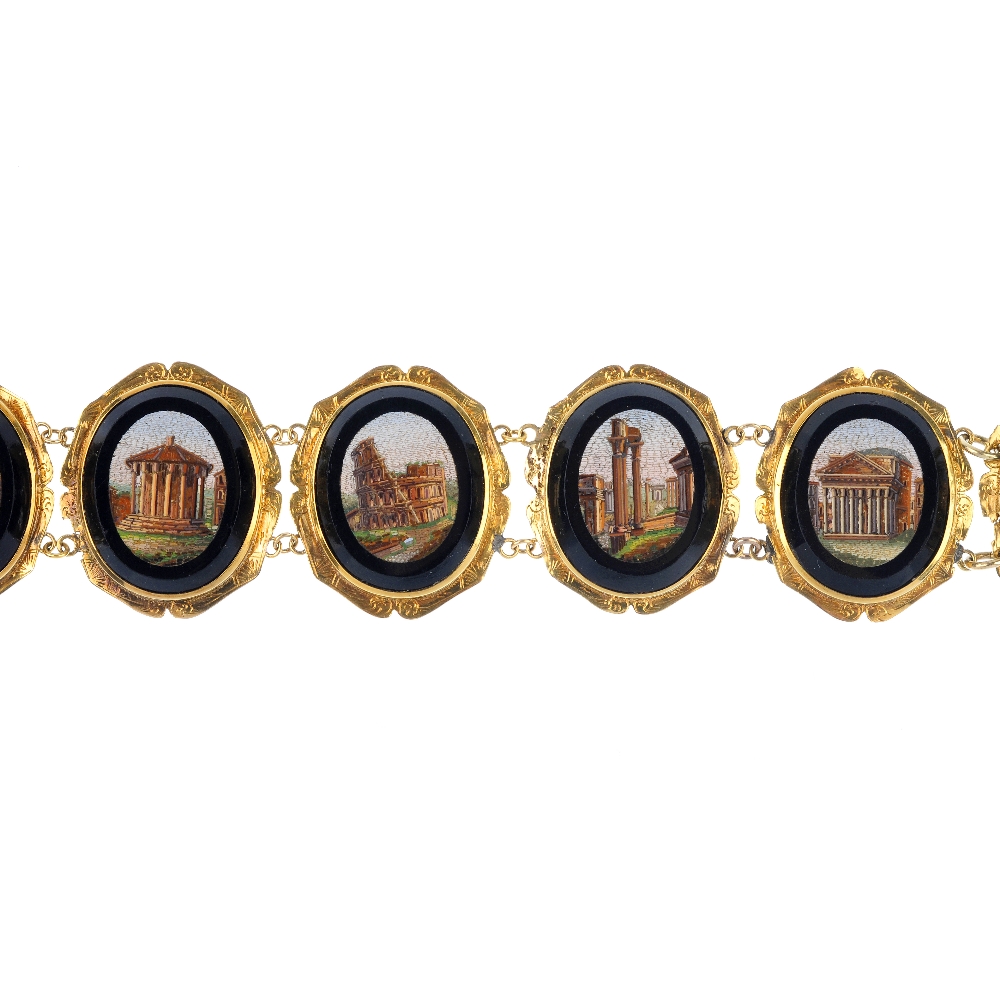 A late 19th century micro mosaic bracelet. Designed as a series of oval-shape panels, depicting a