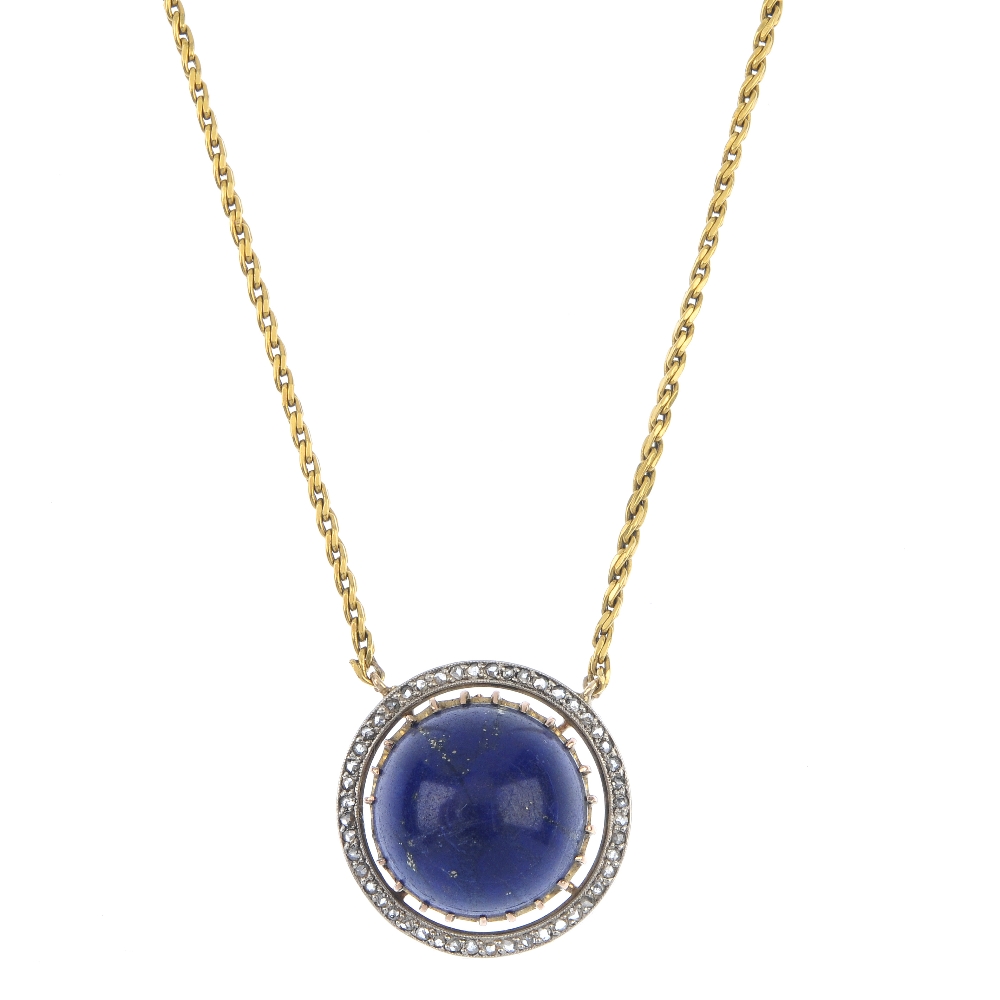 A lapis lazuli and diamond pendant. The circular lapis lazuli cabochon, within a rose-cut diamond