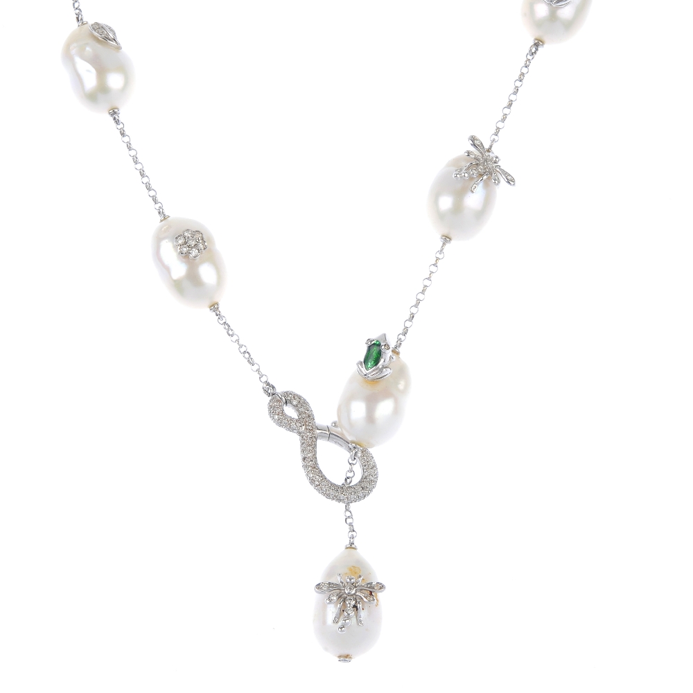 A diamond and baroque pearl necklace. Designed as a series of baroque pearls, some of which have