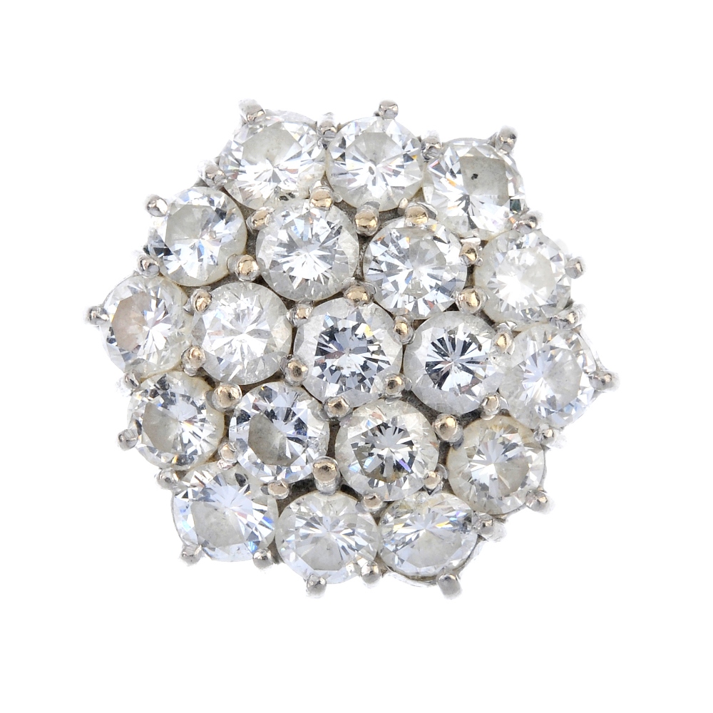 A diamond cluster ring. The brilliant-cut diamond, within a similarly-cut diamond double surround,