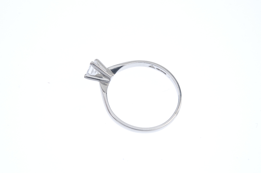 A platinum diamond single-stone ring. The square-shape diamond, weighing 0.59ct, to the plain - Image 3 of 5