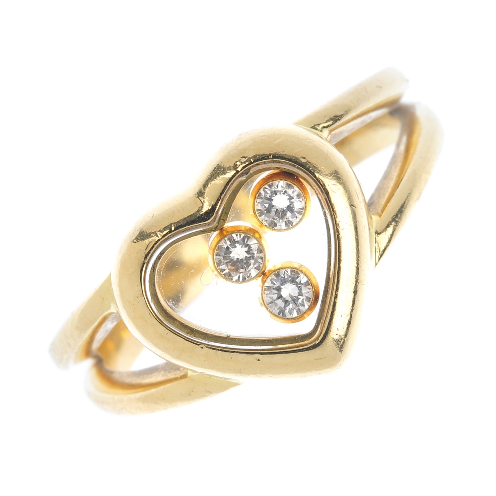 CHOPARD - an 18ct gold 'Happy Diamonds' ring. The three free-moving brilliant-cut diamond collets,