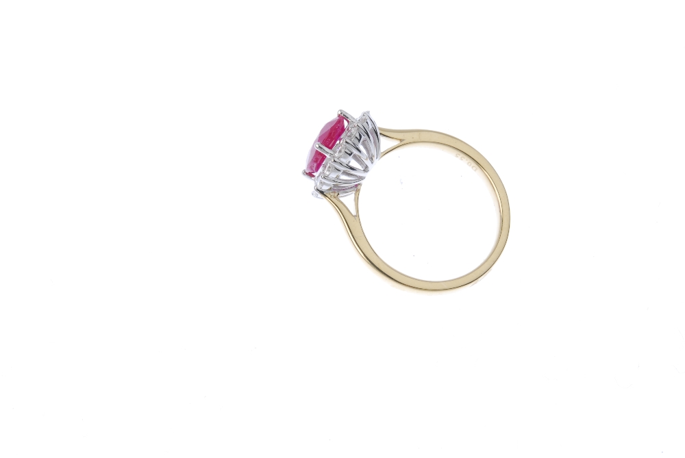 * A ruby and diamond cluster ring. The oval-shape ruby, within a brilliant-cut diamond surround, - Image 4 of 4