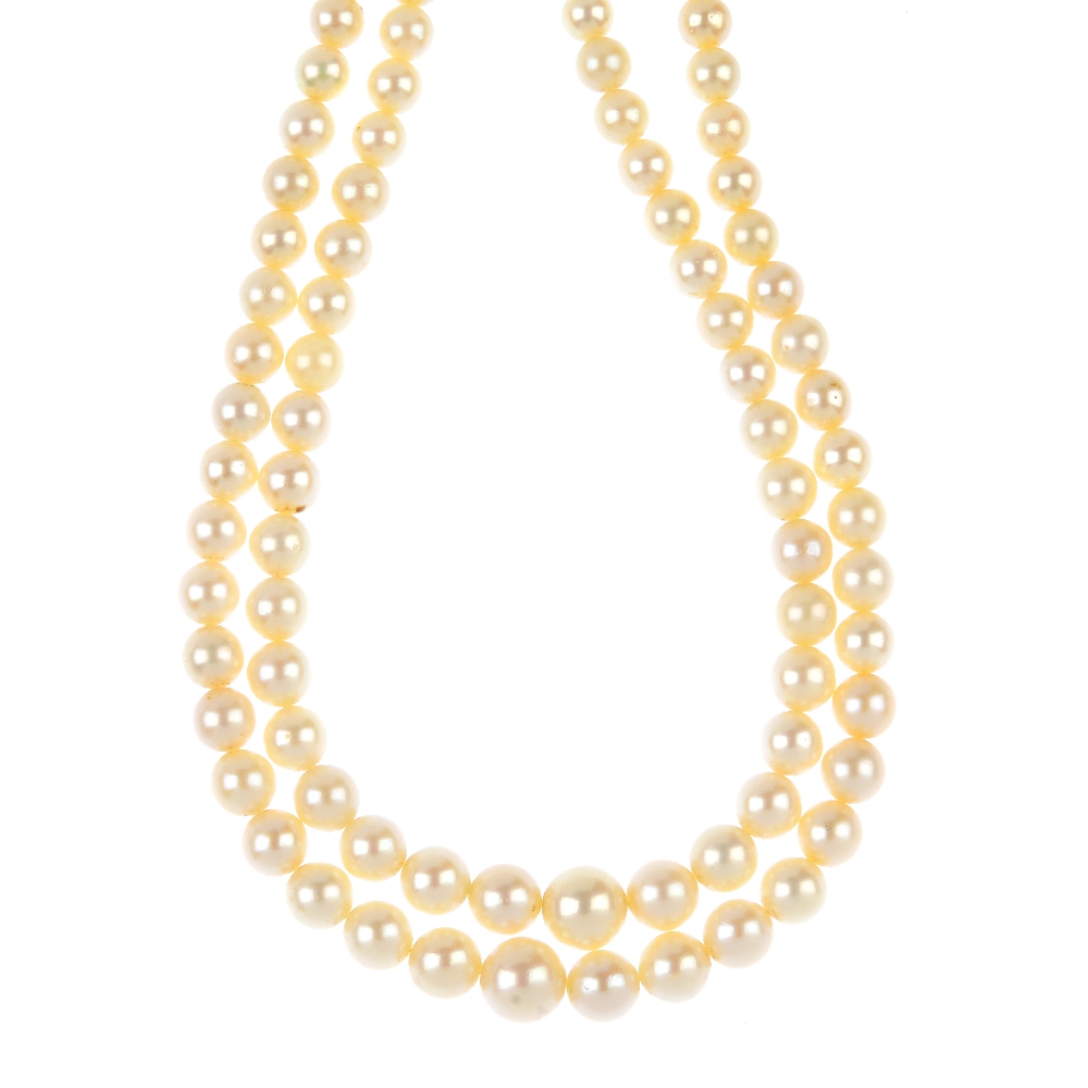 A cultured pearl two-row necklace. Comprising two-rows of seventy-two and seventy-seven graduated