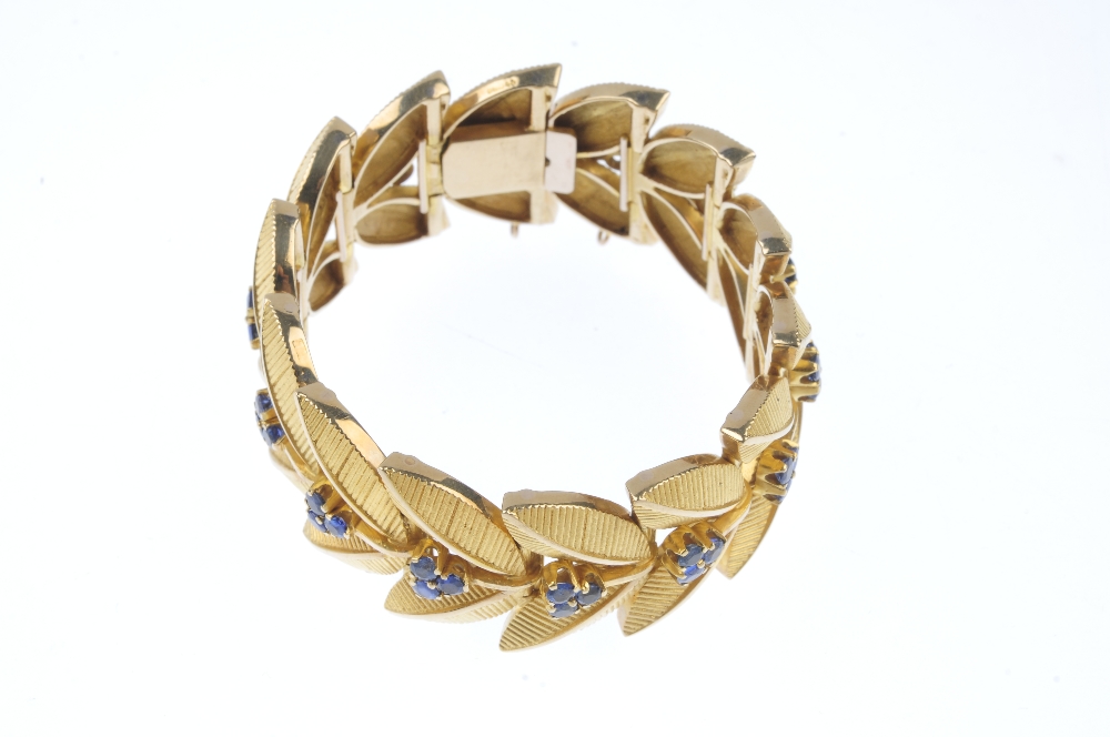 A 1960s 9ct gold sapphire bracelet. Designed as a series of textured twin leaf links, with - Image 4 of 4