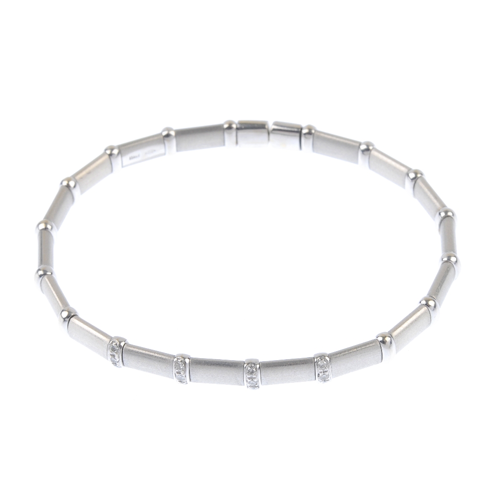 A diamond cuff. Designed as a series of rectangular textured panels, with polished bar spacers, to