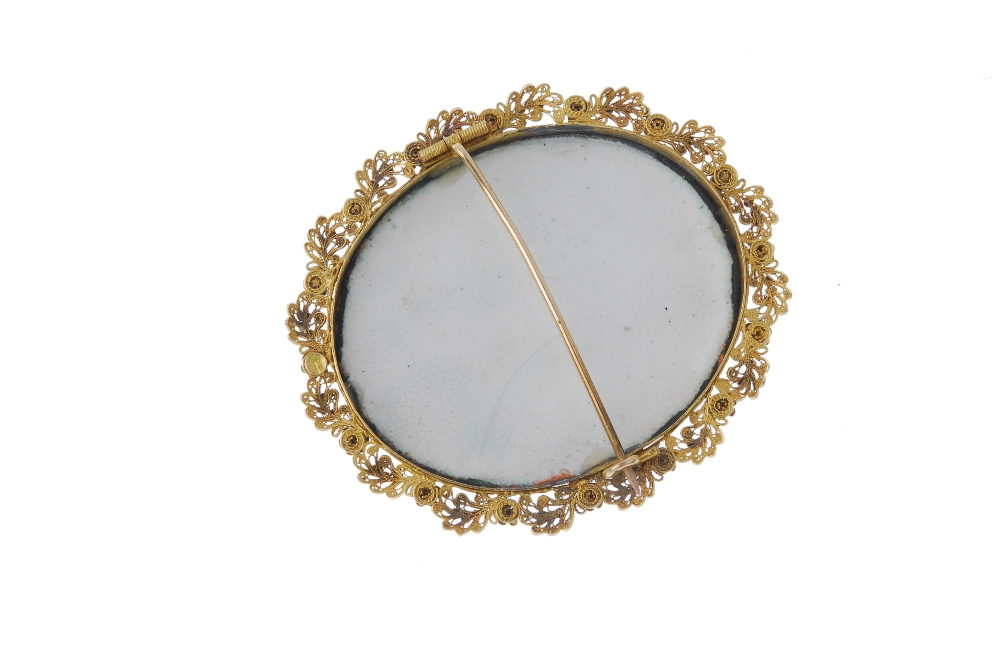 An early 20th century gold miniature portrait brooch. The oval-shape miniature portrait depicting - Image 2 of 2