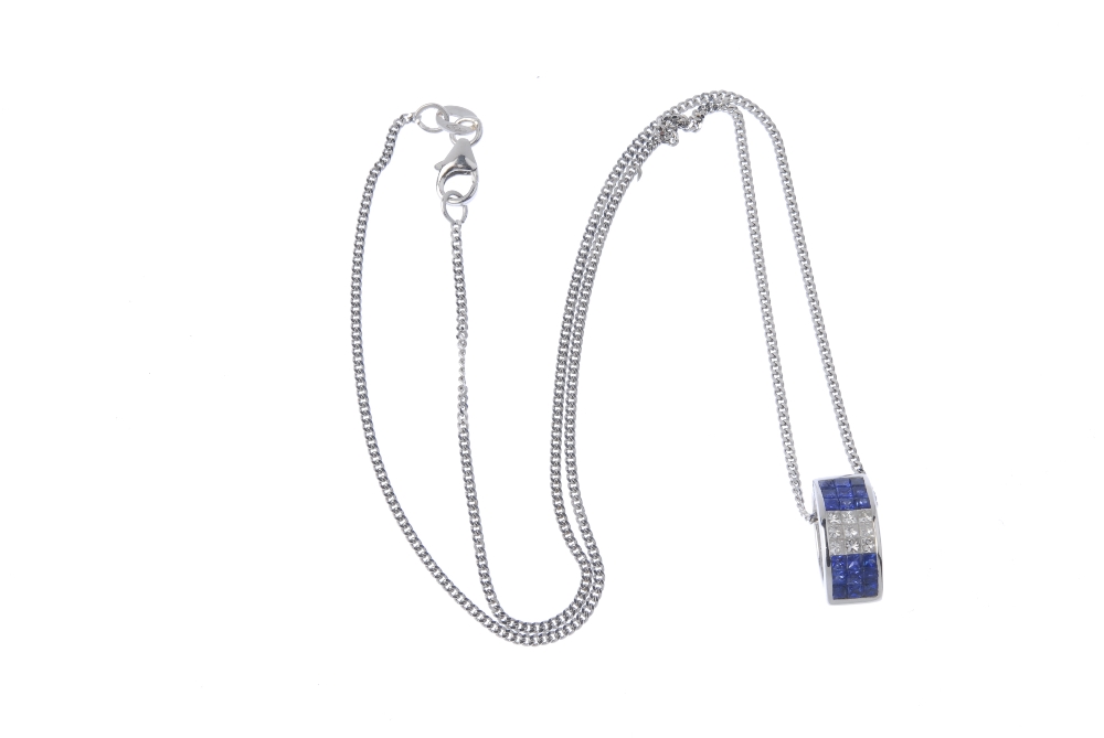 An 18ct gold sapphire and diamond pendant. Designed as a tapered hoop, the two square shape sapphire - Image 3 of 3