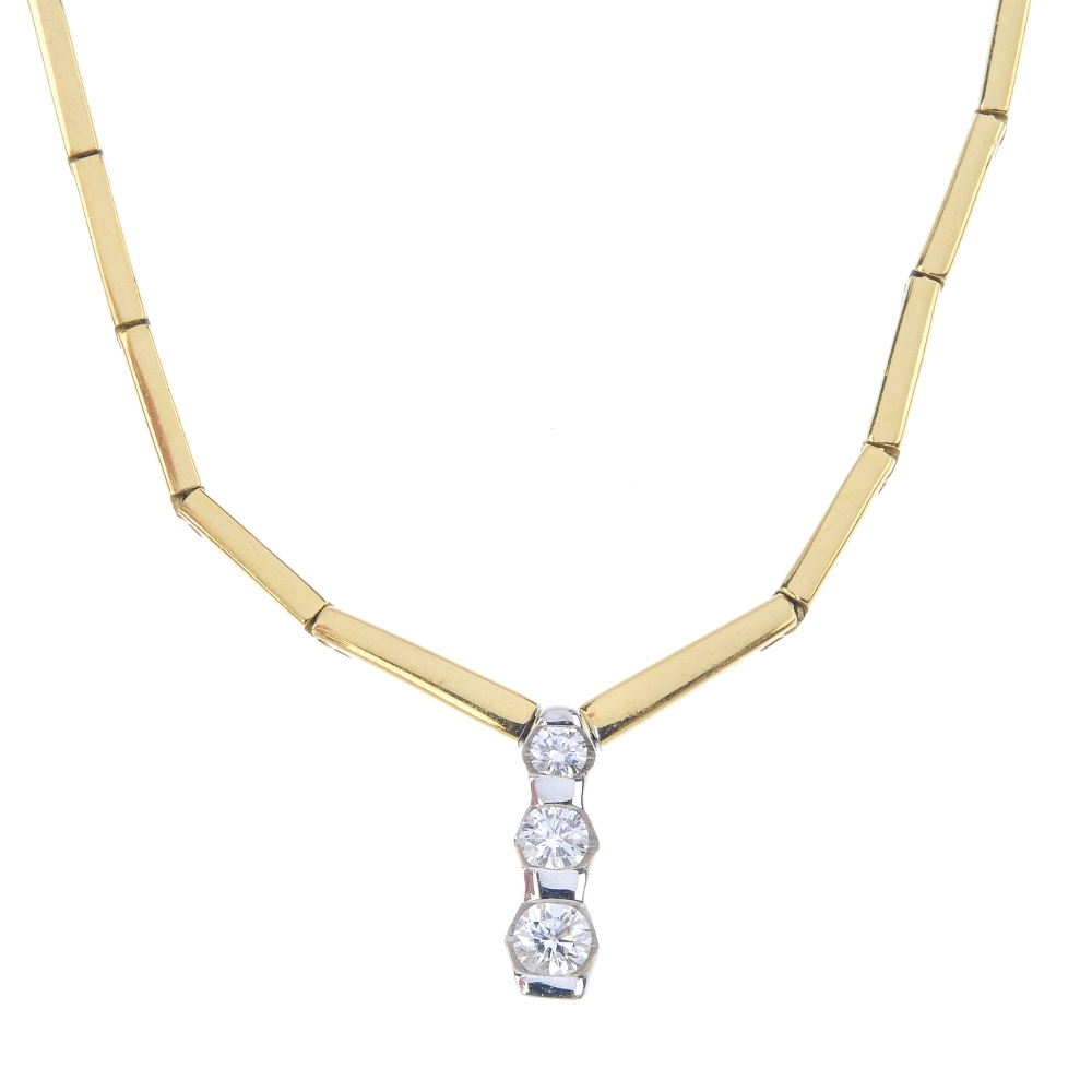 An 18ct gold diamond necklace. The graduated brilliant-cut diamond line, with bar spacers, suspended