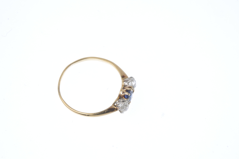 A sapphire and diamond three-stone ring. The oval-shape sapphire, with old-cut diamond sides, to the - Image 3 of 4