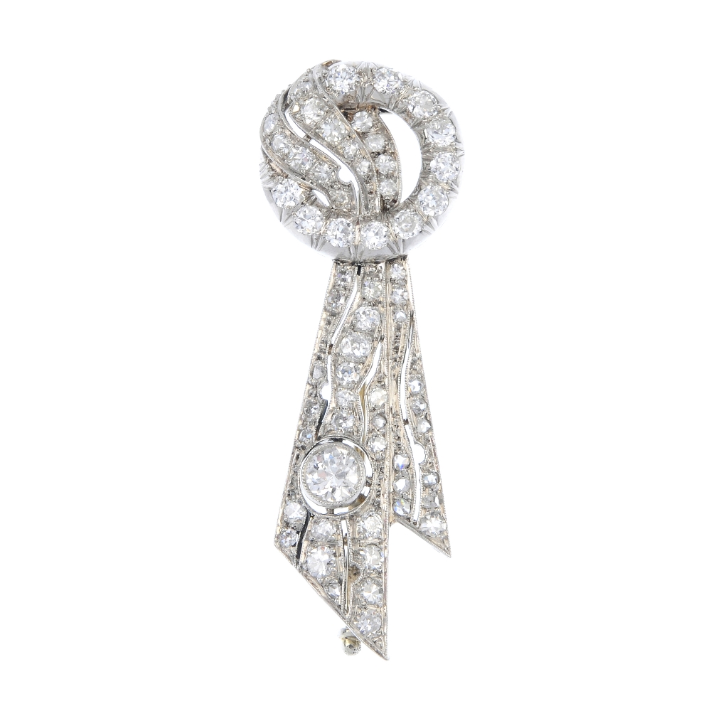 An early 20th century platinum diamond brooch. The brilliant-cut diamond wreath, to the