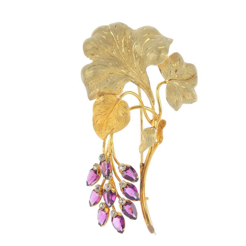 A mid 19th century diamond and garnet foliate brooch. Designed as a series of scrolling leaves,