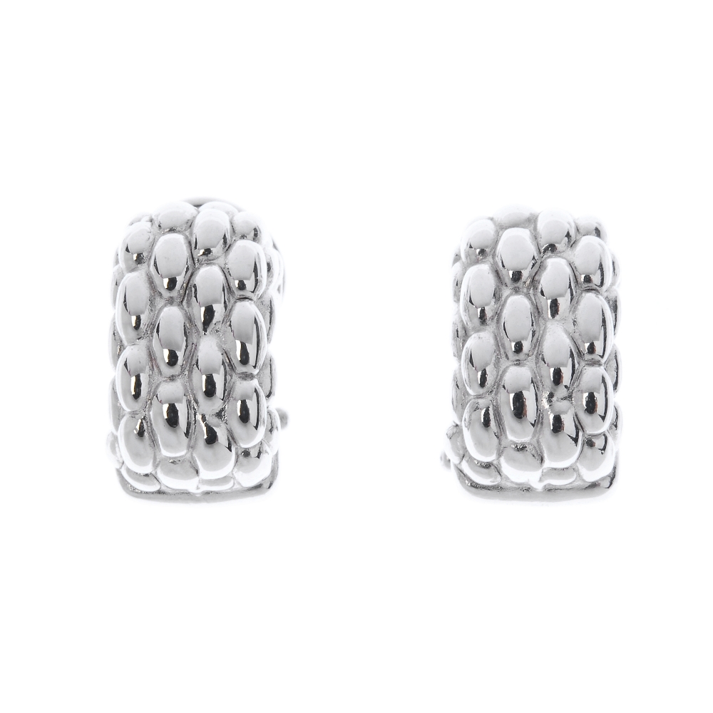 FOPE - a pair of 18ct gold ear studs. Each designed with textured beaded detail and clip back