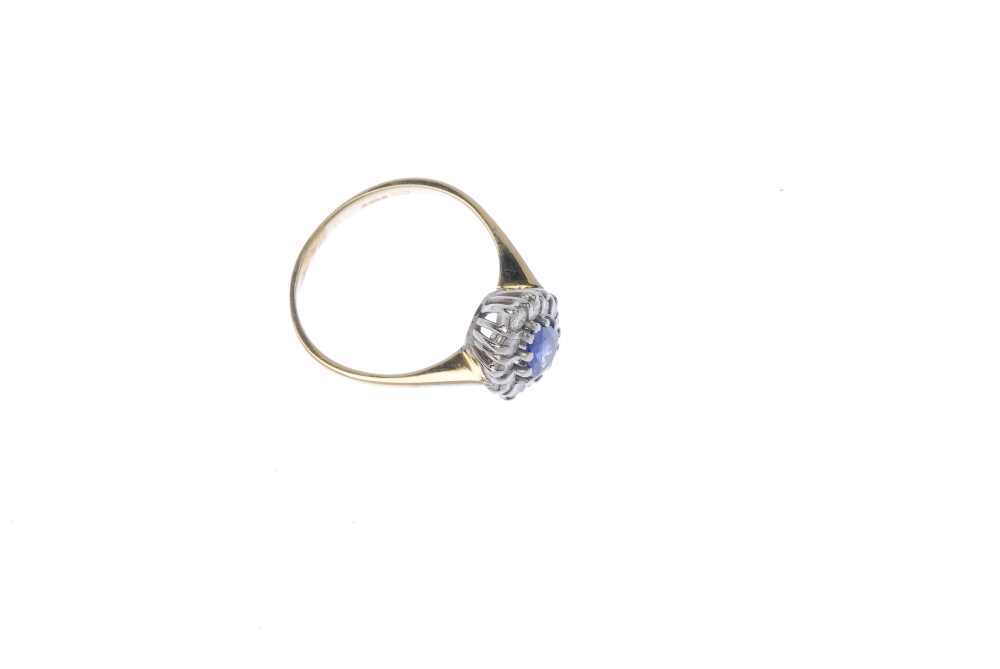 An 18ct gold sapphire diamond cluster ring. The pear-shape sapphire, within a brilliant-cut - Image 3 of 4