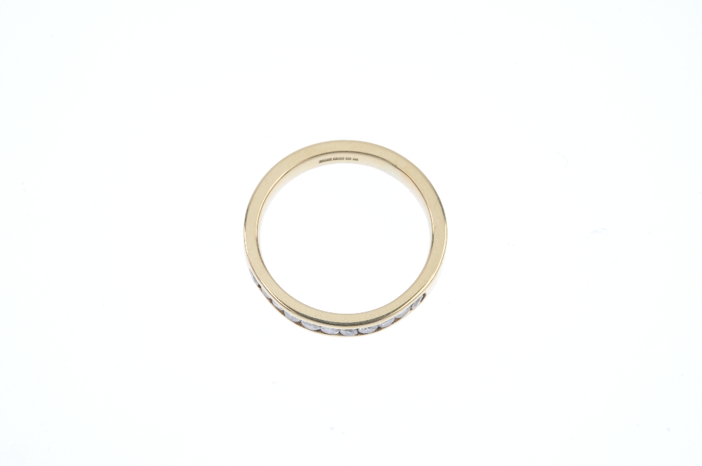 An 18ct gold diamond half-circle eternity ring. The brilliant-cut diamond line, to the plain band. - Image 2 of 3